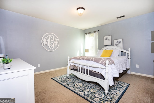 bedroom featuring light carpet