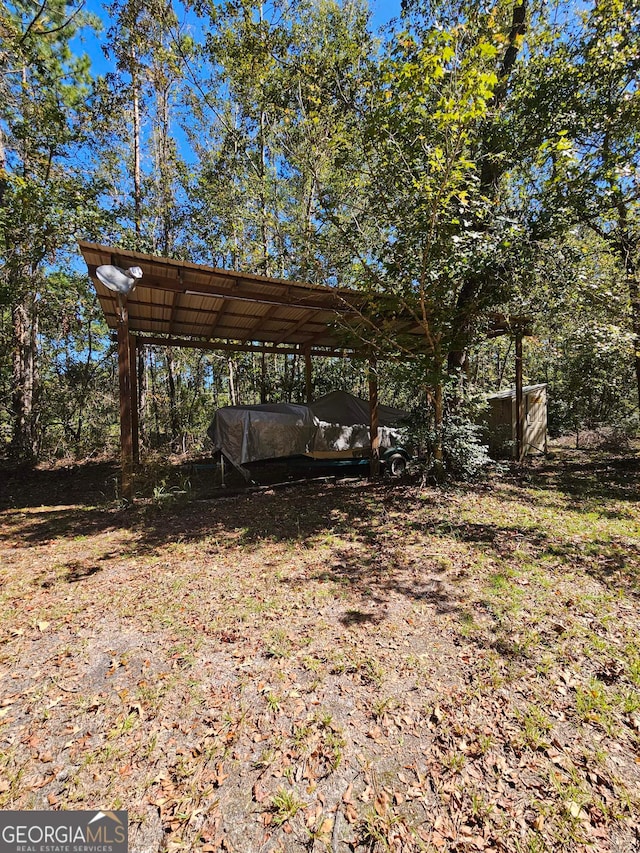 view of yard with a carport