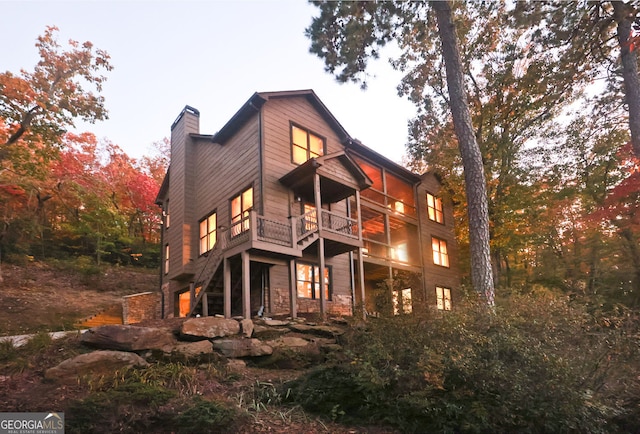 rear view of property with a balcony