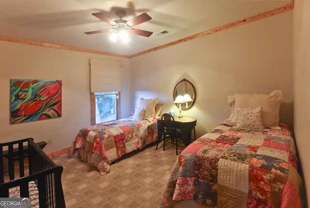 bedroom featuring light colored carpet and ceiling fan