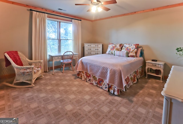 bedroom featuring ceiling fan and carpet