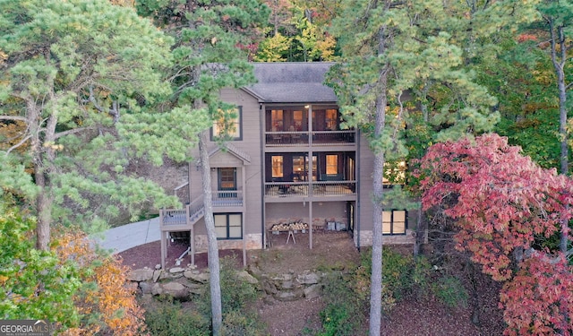 back of property featuring a balcony