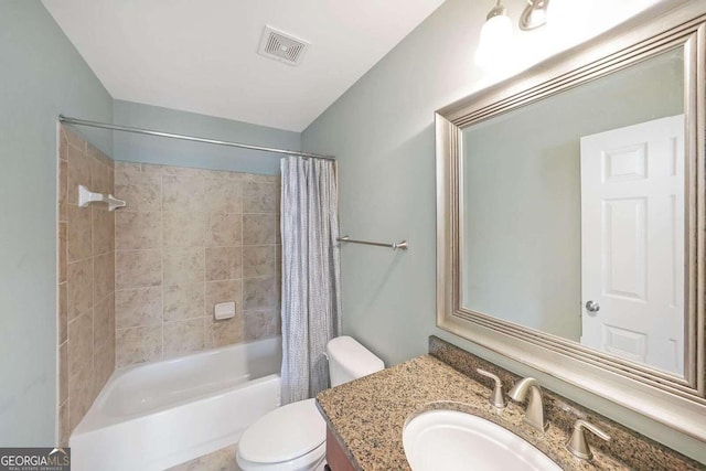 full bathroom with vanity, shower / bath combo with shower curtain, and toilet