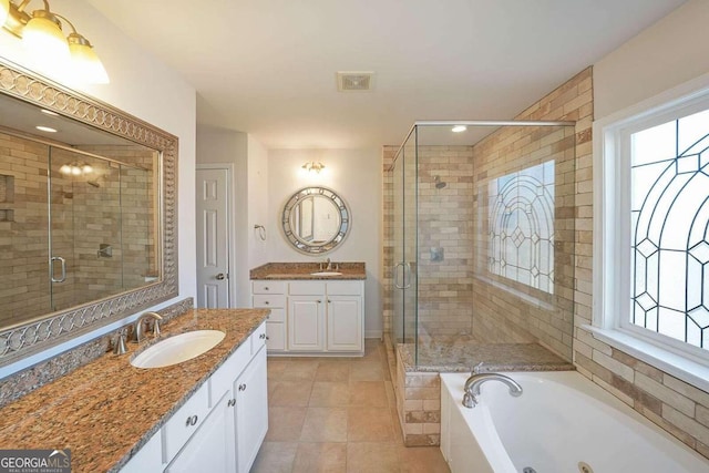 bathroom featuring vanity, shower with separate bathtub, and tile patterned flooring