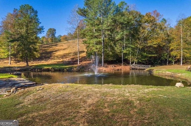 surrounding community with a water view