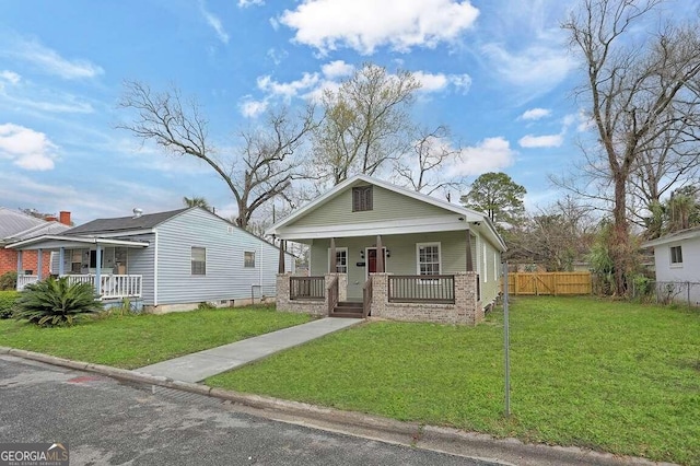 view of front of home featuring a porch and a front lawn