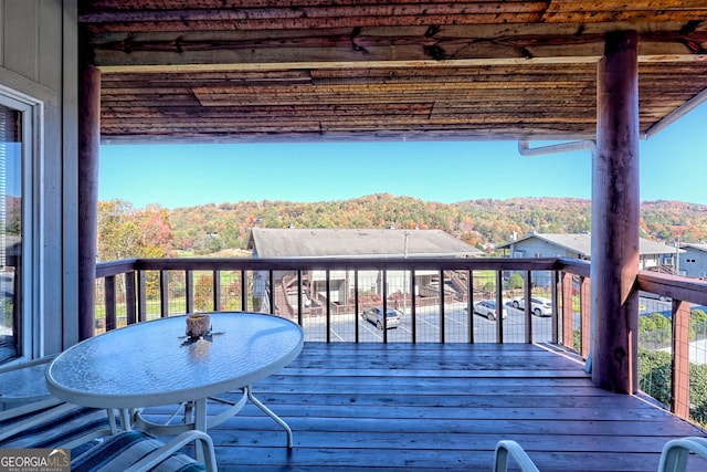 wooden deck featuring a mountain view