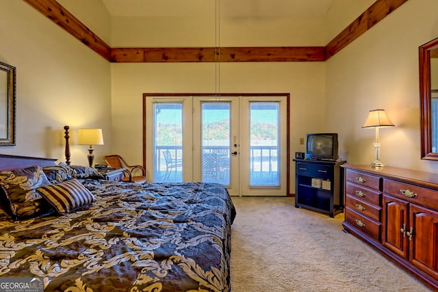 carpeted bedroom with access to outside, french doors, and beamed ceiling