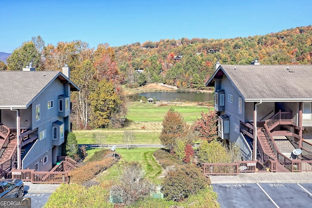 birds eye view of property with a water view