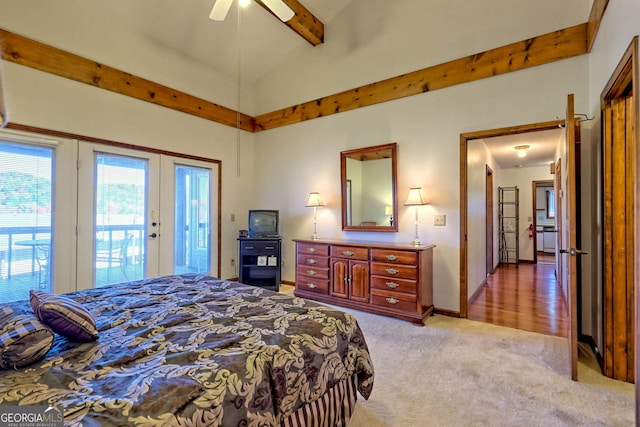 bedroom featuring french doors, vaulted ceiling with beams, access to exterior, light carpet, and ceiling fan