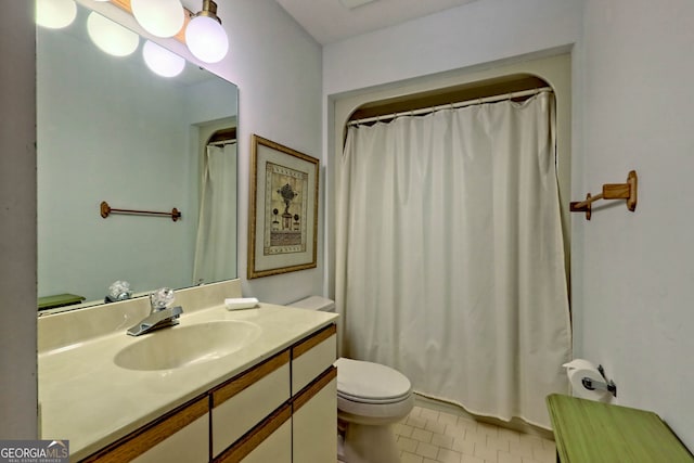 bathroom featuring vanity, toilet, a shower with curtain, and tile patterned flooring