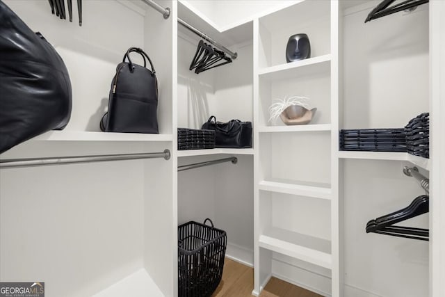 walk in closet featuring hardwood / wood-style floors