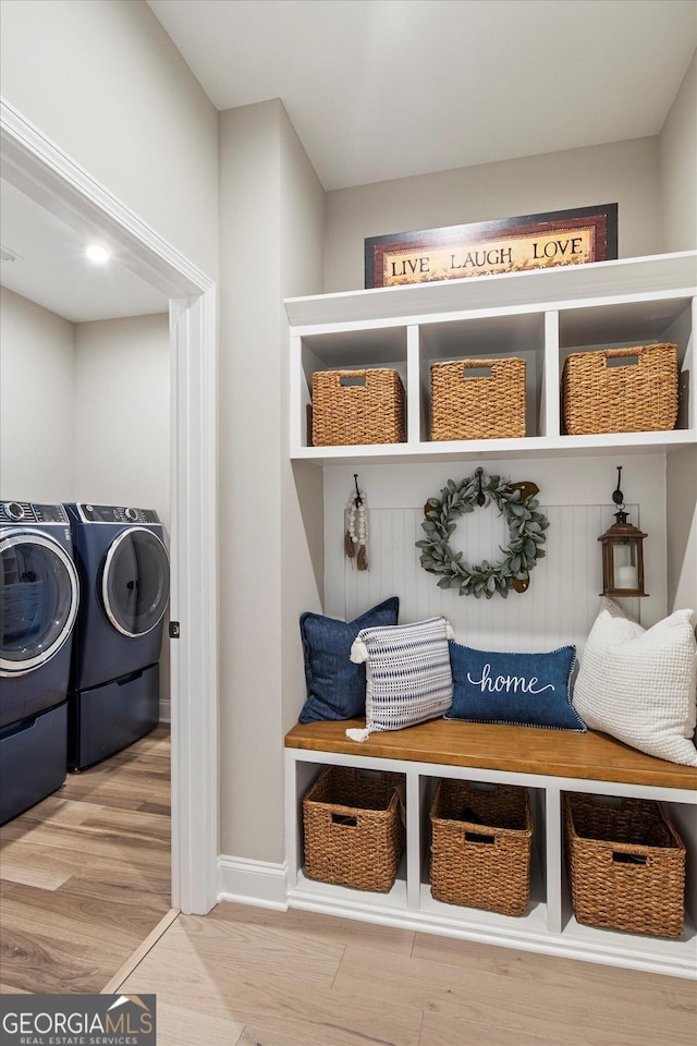 mudroom with washer and dryer and hardwood / wood-style flooring