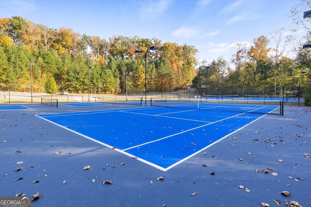 view of sport court with basketball hoop