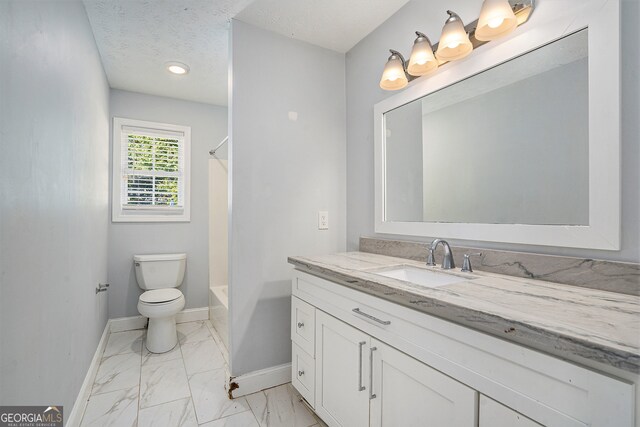 full bathroom featuring vanity, a textured ceiling, toilet, and shower / bath combination