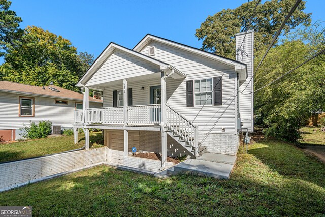 bungalow with central air condition unit, a front lawn, covered porch, and a garage