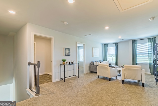 living room featuring light carpet