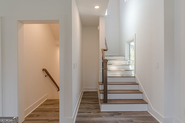 stairway featuring hardwood / wood-style flooring