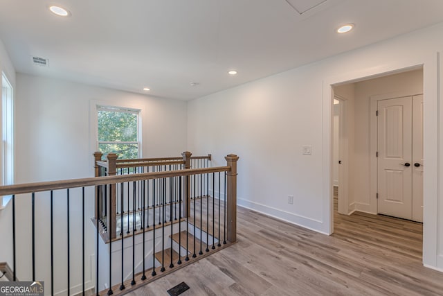 hall with light hardwood / wood-style floors