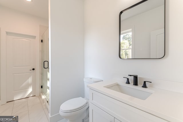 bathroom with vanity, toilet, and walk in shower