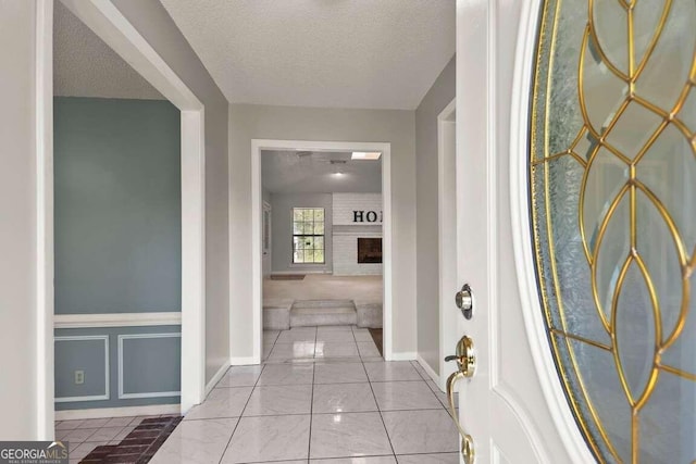 hall with a textured ceiling