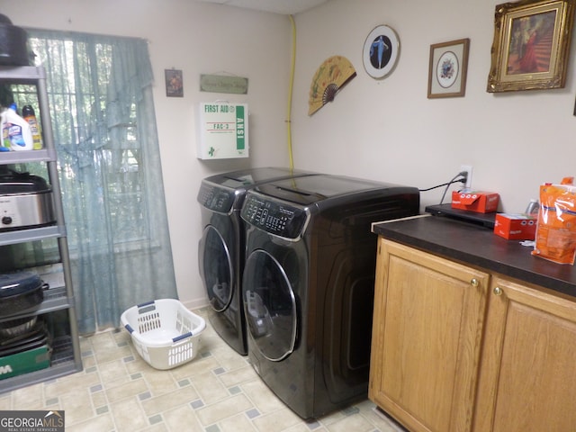 clothes washing area featuring separate washer and dryer