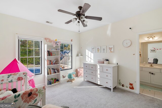 playroom featuring light carpet, sink, and ceiling fan