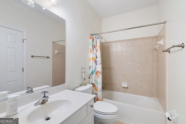 full bathroom with vanity, shower / bath combination with curtain, and toilet