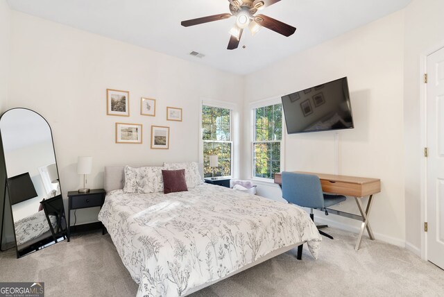 carpeted bedroom with ceiling fan