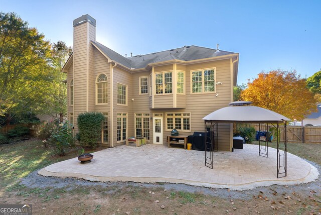 back of house featuring a gazebo and a patio