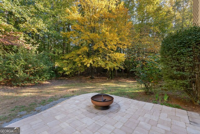 view of patio featuring an outdoor fire pit