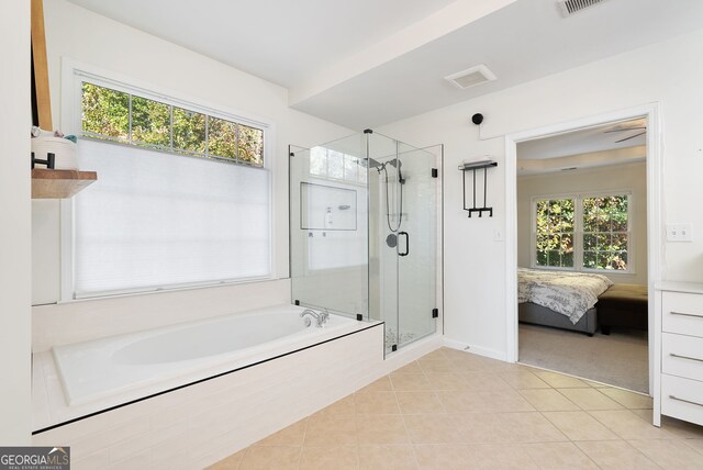 bathroom with tile patterned flooring and plus walk in shower