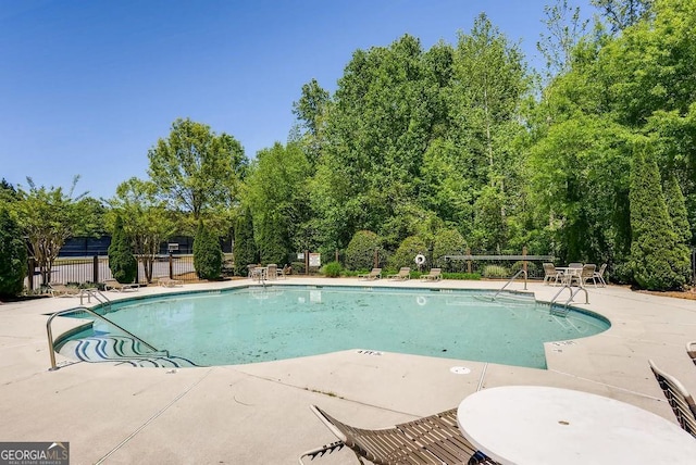 view of pool featuring a patio