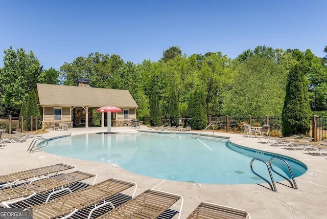 view of swimming pool featuring a patio