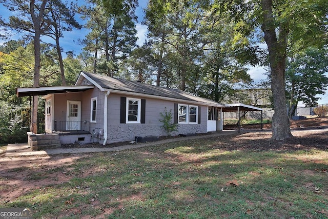 view of side of property with a carport