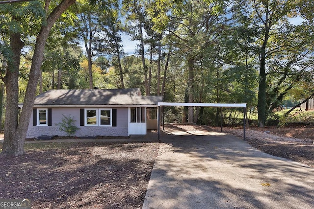 ranch-style house with a carport