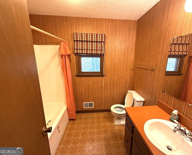 full bathroom with visible vents, wallpapered walls, toilet, vanity, and a textured ceiling