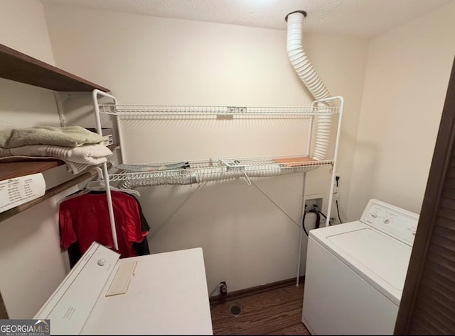 laundry room featuring laundry area, hookup for a washing machine, wood finished floors, and a textured ceiling