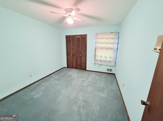 unfurnished bedroom featuring a closet, carpet flooring, visible vents, and baseboards