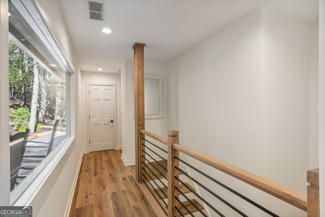 corridor featuring light hardwood / wood-style floors