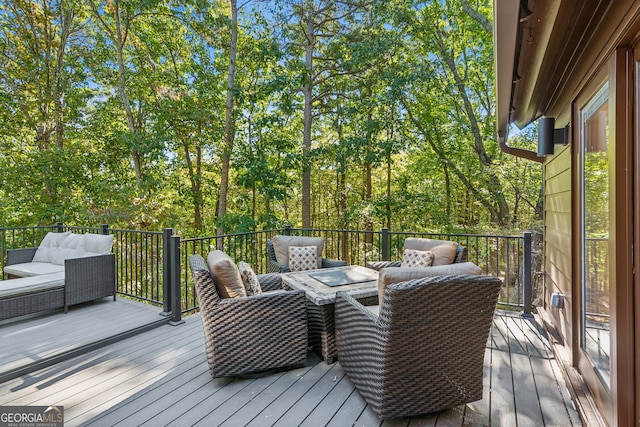 wooden deck featuring an outdoor hangout area