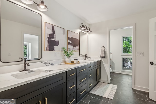 bathroom with vanity, tile patterned floors, and toilet