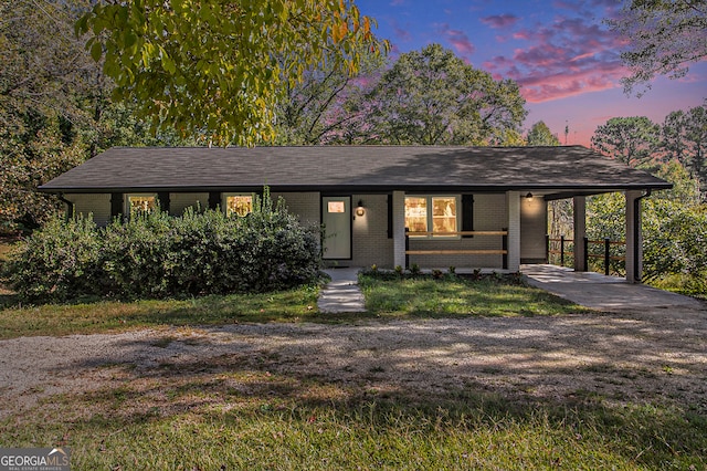 view of front of property with a carport