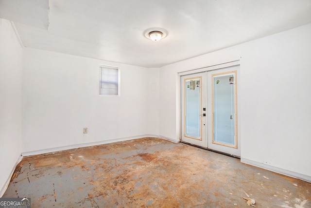 unfurnished room with french doors