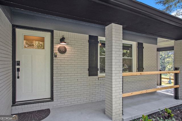 property entrance featuring covered porch