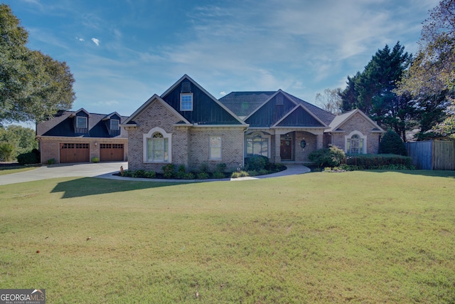 view of front of property with a front lawn and a garage