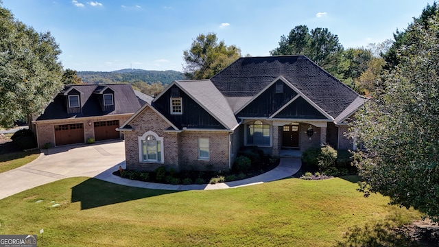 craftsman-style home with a front yard, covered porch, and a mountain view