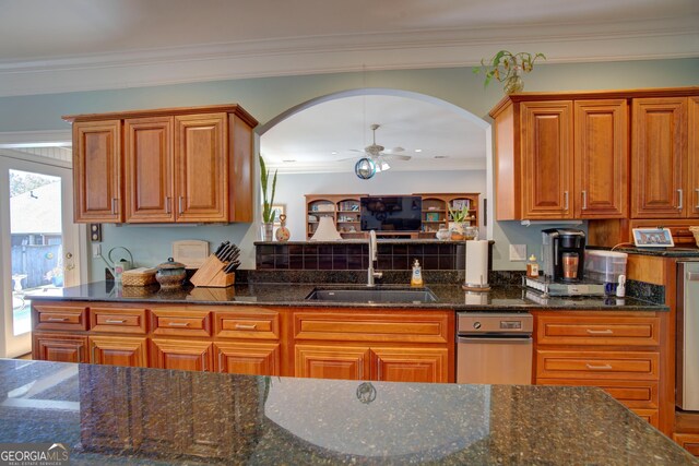4 Bridgeview Dr SE, Rome, GA 30161 - kitchen with ornamental molding, a sink, dark stone counters, arched walkways, and a ceiling fan