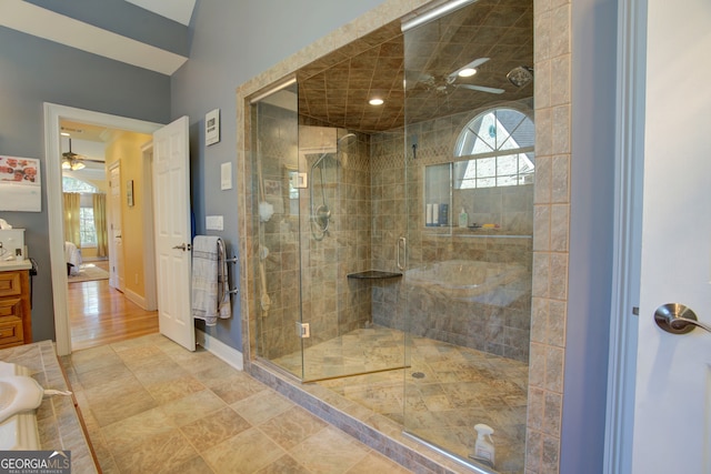 bathroom with vanity, a shower with shower door, hardwood / wood-style flooring, and ceiling fan