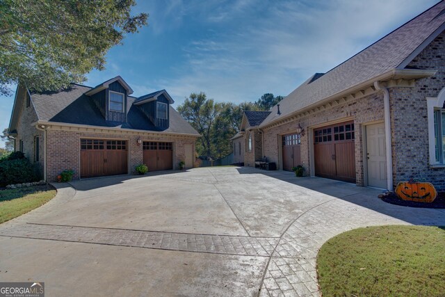 4 Bridgeview Dr SE, Rome, GA 30161 - view of side of home with a shingled roof, concrete driveway, and brick siding
